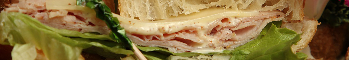 Eating Deli Sandwich at Saigon Bakery & Deli restaurant in Falls Church, VA.